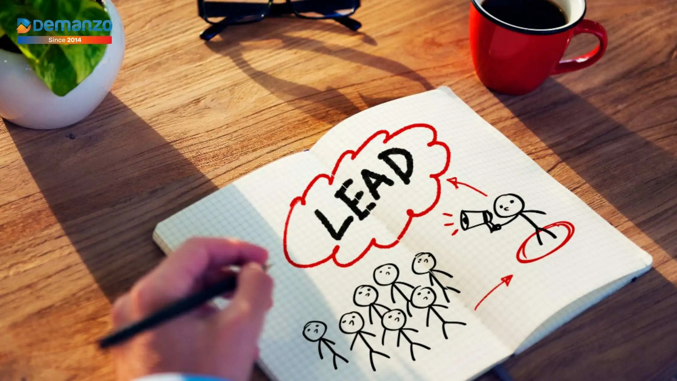 Hand-drawn lead generation concept in a notebook, showing a marketer attracting leads, representing SaaS and website conversion strategies by Demanzo