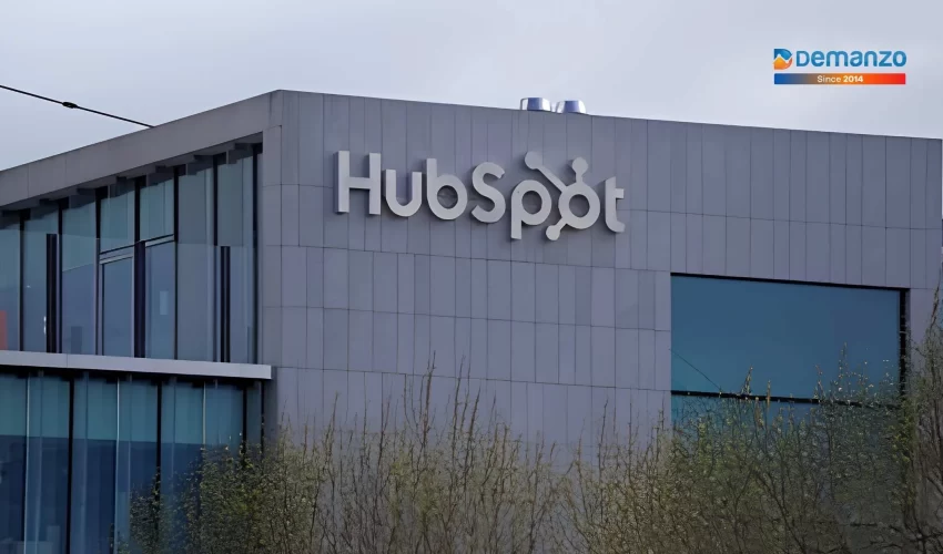 Exterior view of a modern office building with the HubSpot logo displayed on the facade.